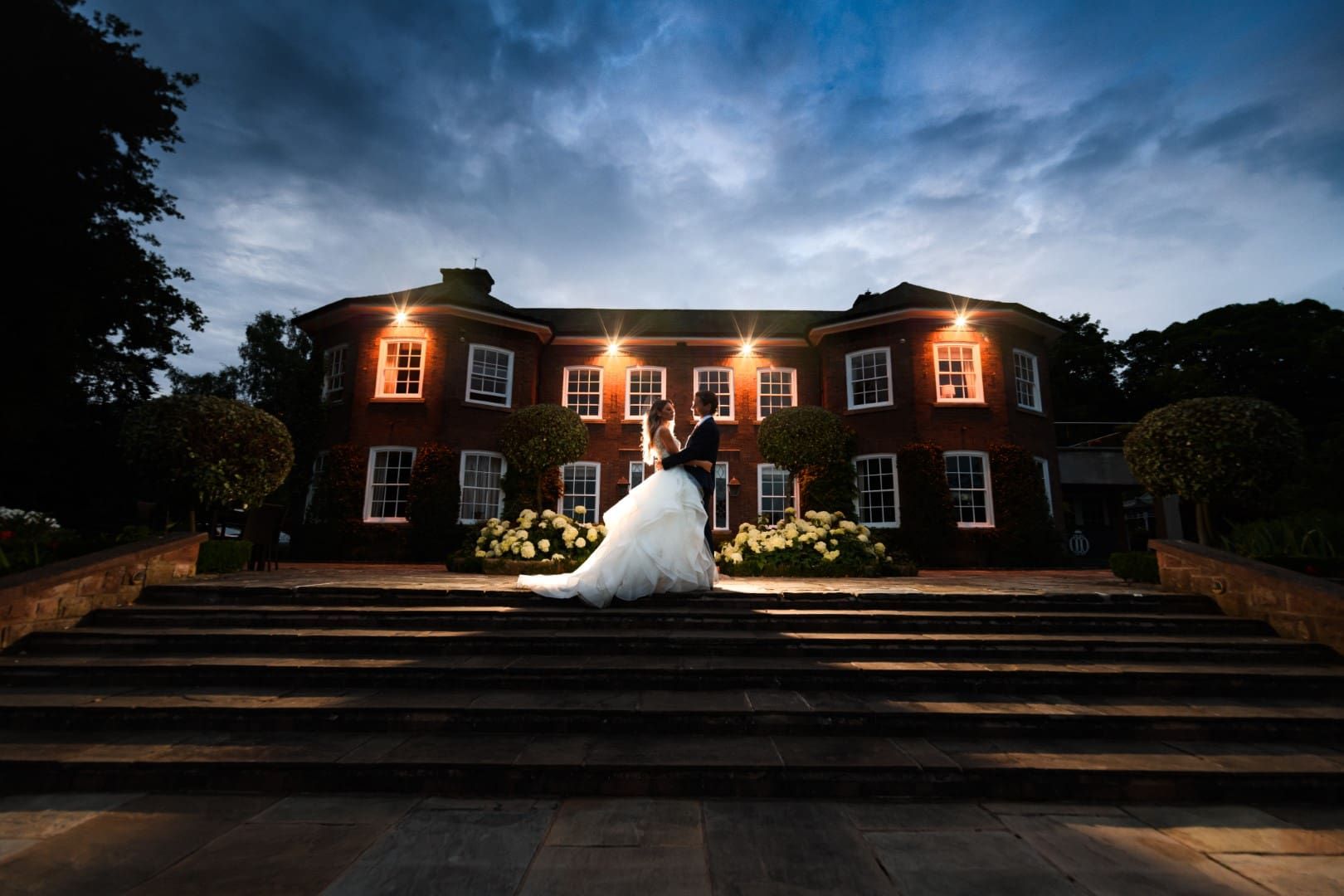 Bride And Groom At Night On Terrace 1 – Joe Bickerton